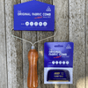 Bright blue Eezy Comb and Super Eezy Comb packaging material around fabric combs. Wooden Handle. Guaranteed to last a life time or two.